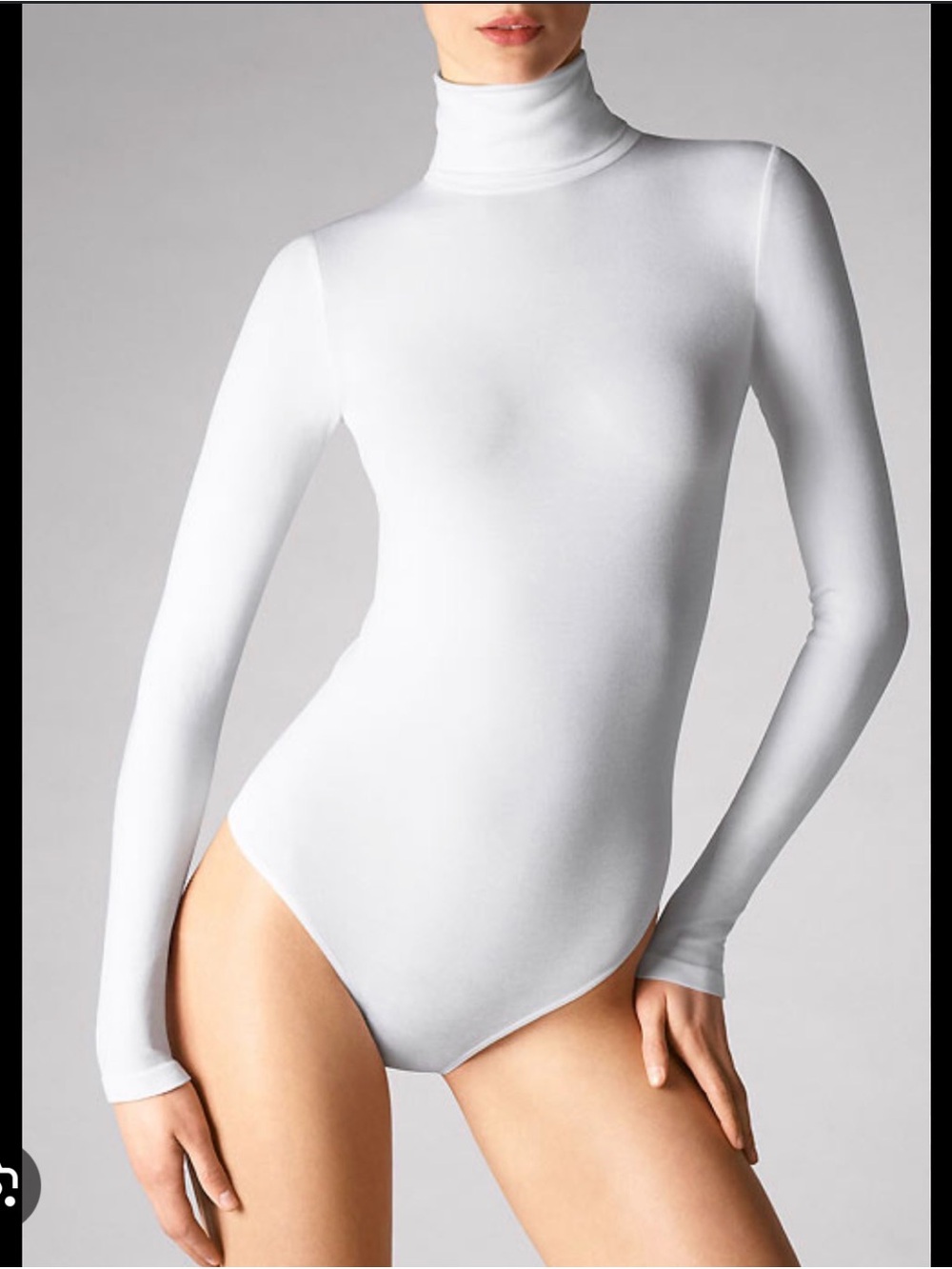 Wolford turtleneck bodysuit features long sleeves and a thong cut